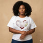 Women's rhinestone t-shirt with a heart design featuring pearl oval stones and reflective film.