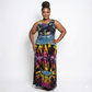 Woman wearing a tie-dye dress on a white background