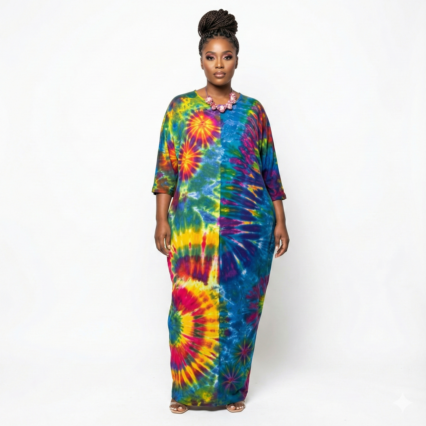 Woman wearing a tie-dye dress on a white background