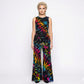 Woman wearing a colorful tie-dye  pants and top on a white background