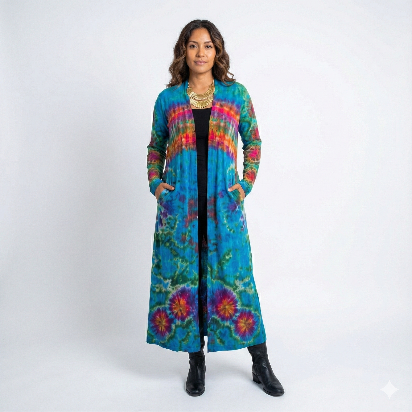 Woman wearing a long, colorful tie-dye cardigan on a white background