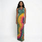 Model wearing a tie-dye dress on a white background
