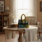 Colorful handbag on a wooden table in a cozy living room setting