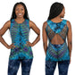 Woman wearing a blue tie-dye tank top with cut-out design and matching pants on a gray background