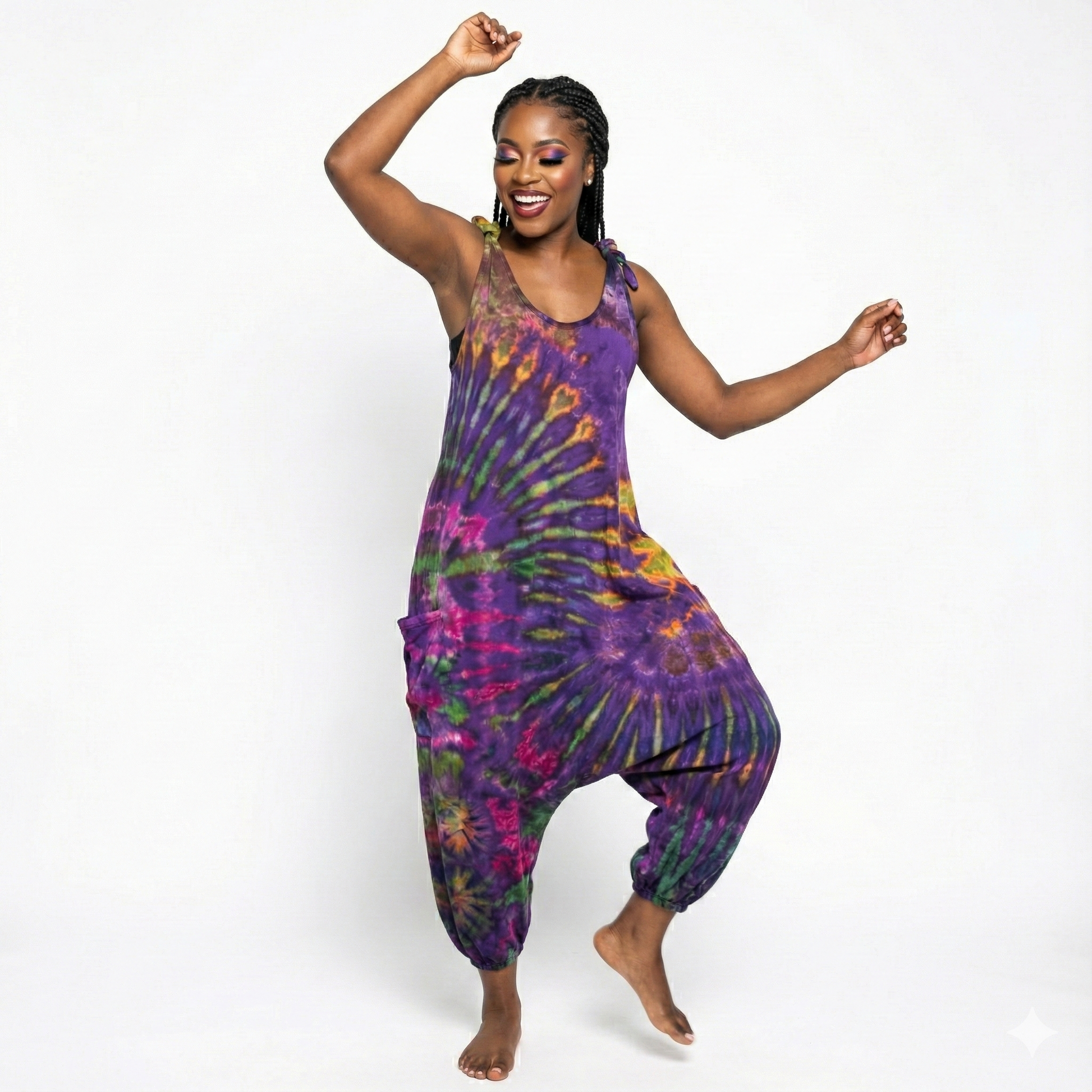 Woman wearing a tie-dye jumpsuit on a white background