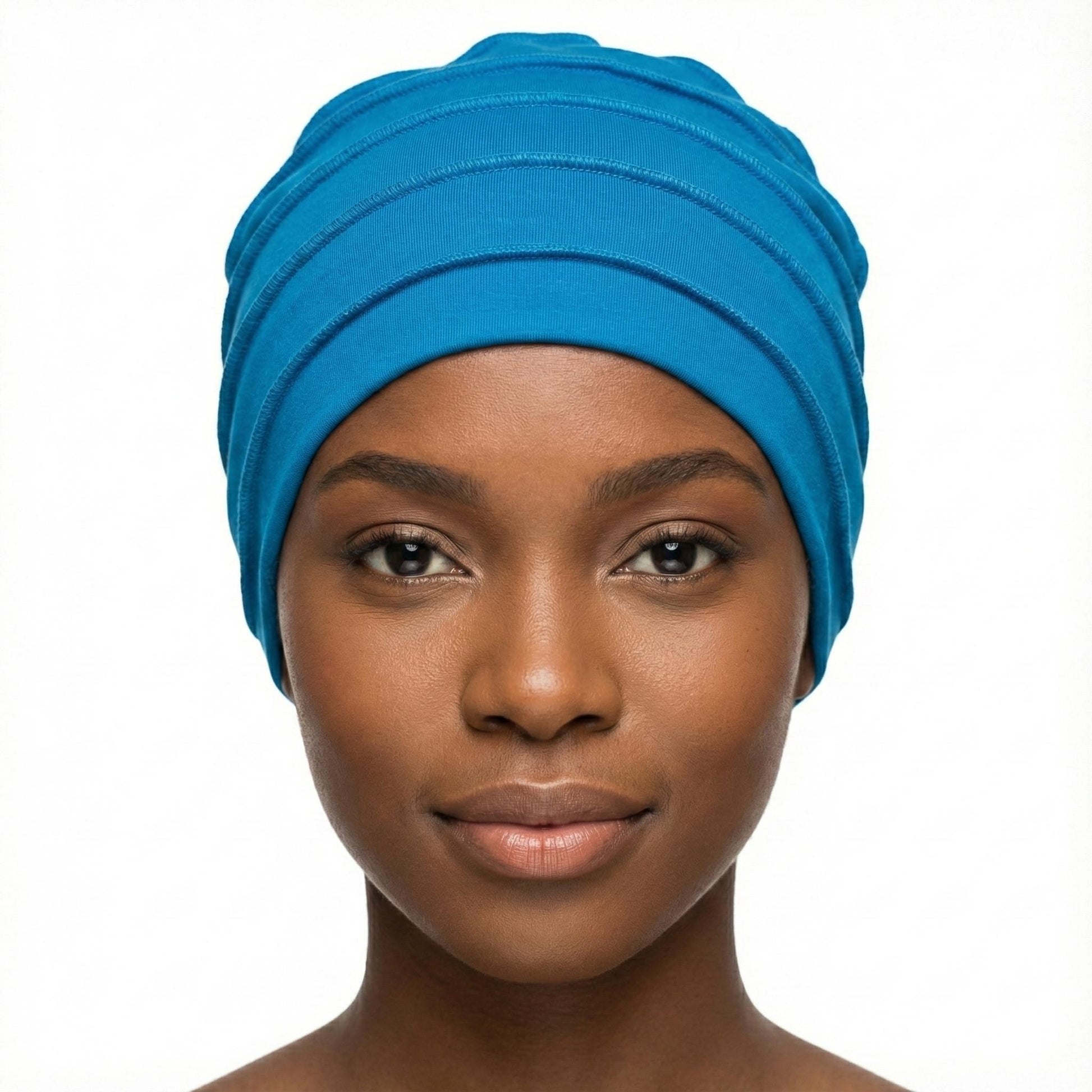Woman wearing a blue hat on a white background-Sanjules