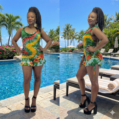 Woman in a colorful dress by a pool with palm trees in the background