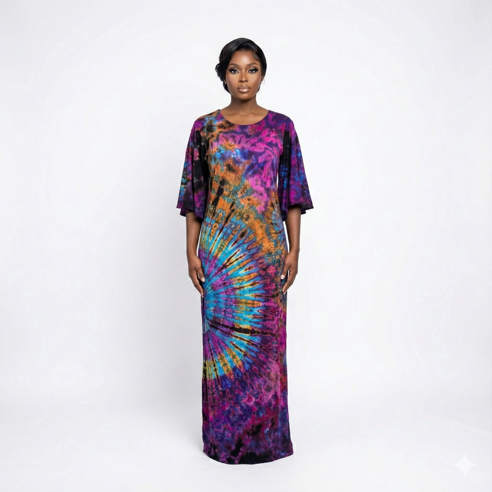 Woman wearing a tie-dye dress on a white background
