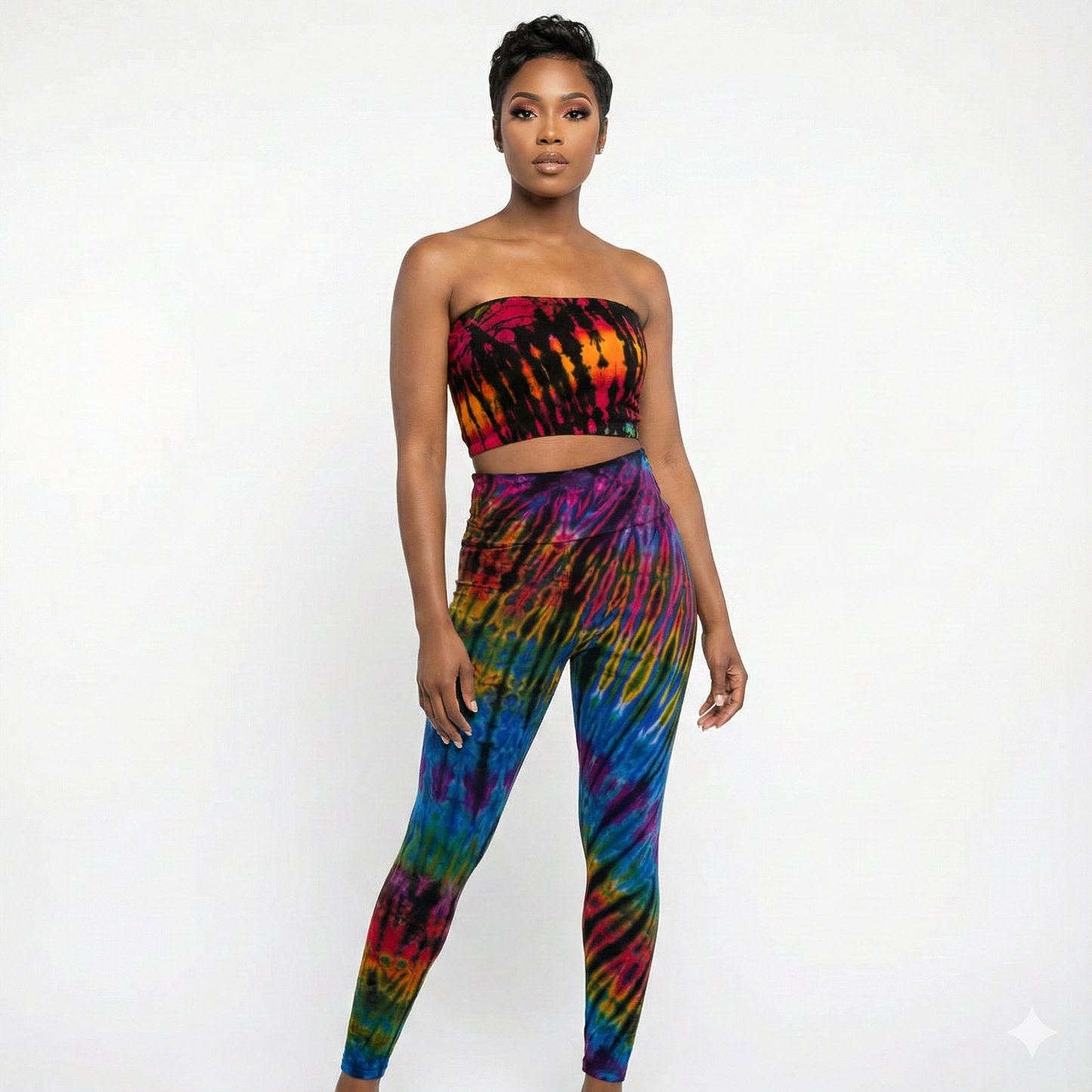 Woman wearing a colorful tie-dye tube top on a white background