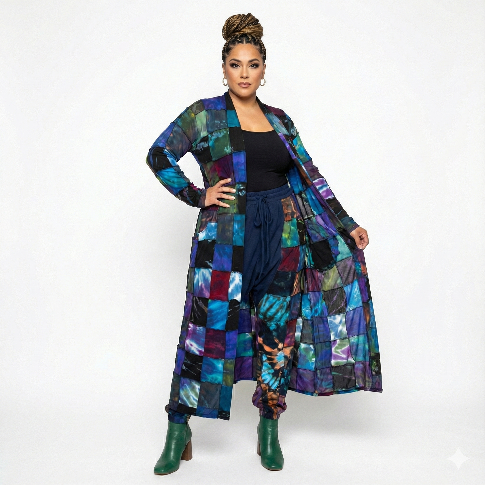 Woman wearing a colorful patchwork duster and pants on a white background
