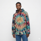 Person wearing a tie-dye hoodie on a white background