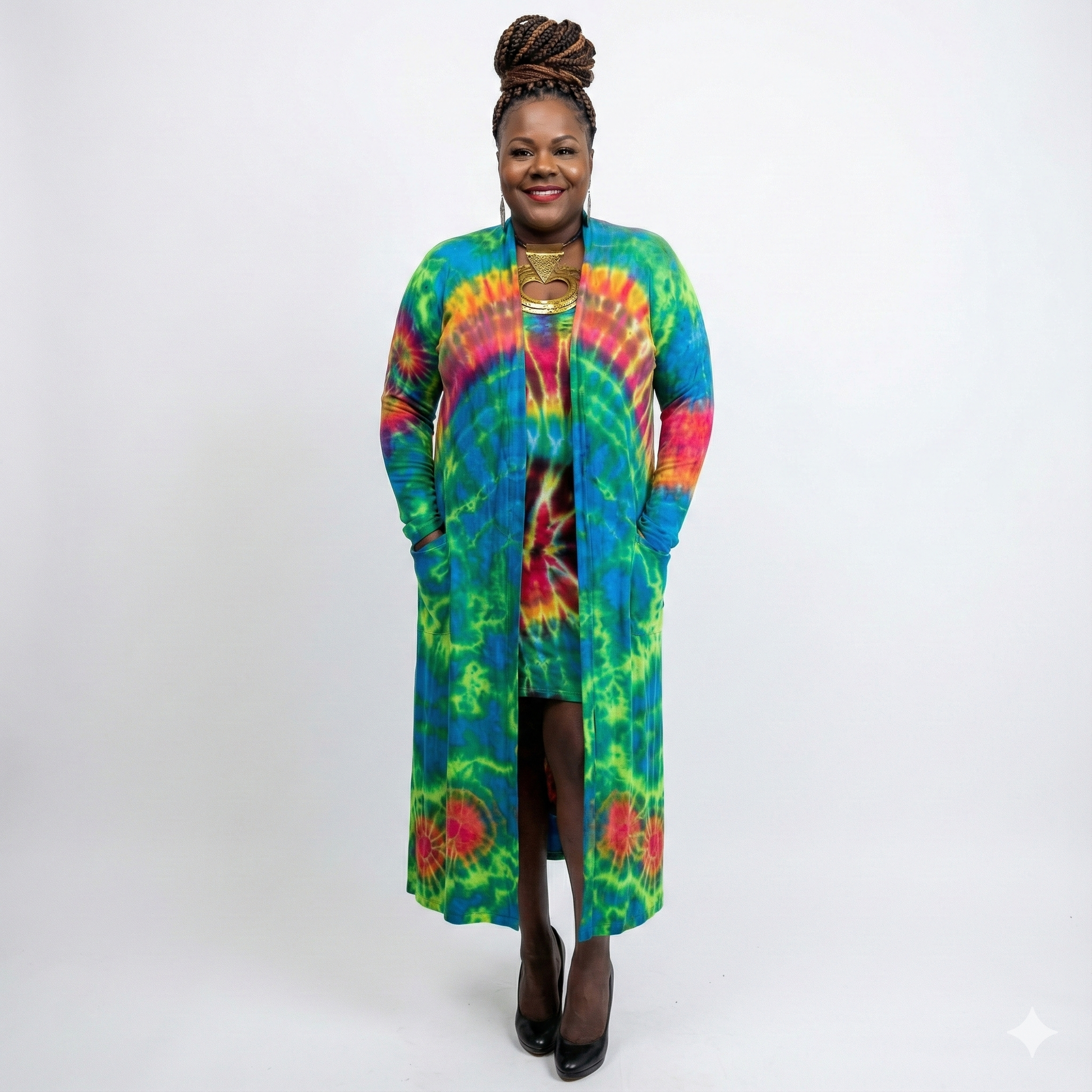 Person wearing a colorful tie-dye long cardigan on a white background