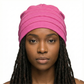 Woman wearing a pink hat on a white background