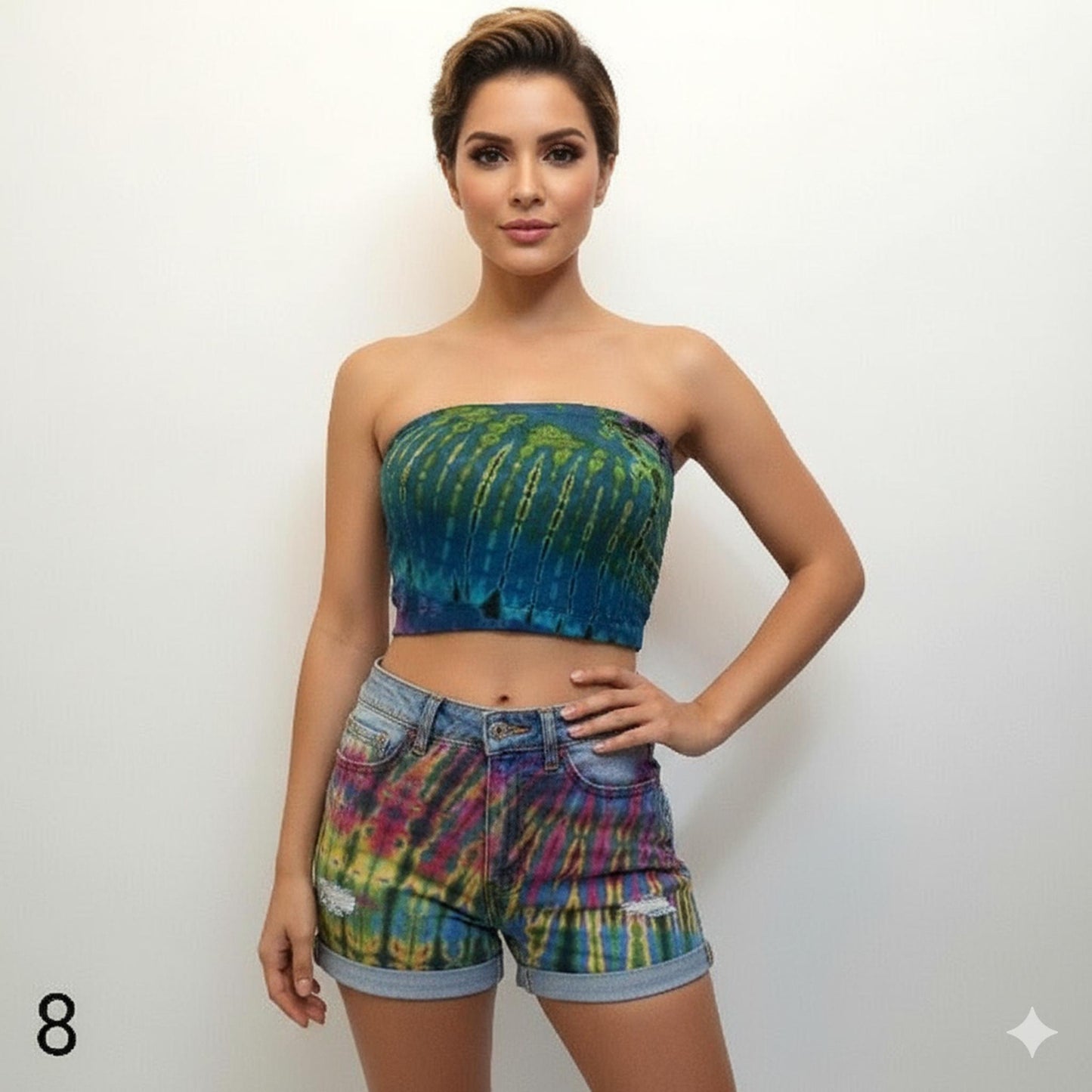 Woman wearing a tie-dye tube top and shorts on a white background