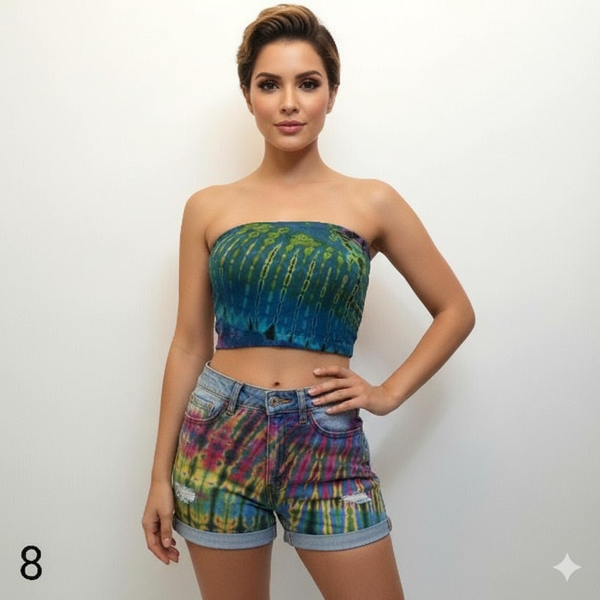 Woman wearing a tie-dye tube top and shorts on a white background