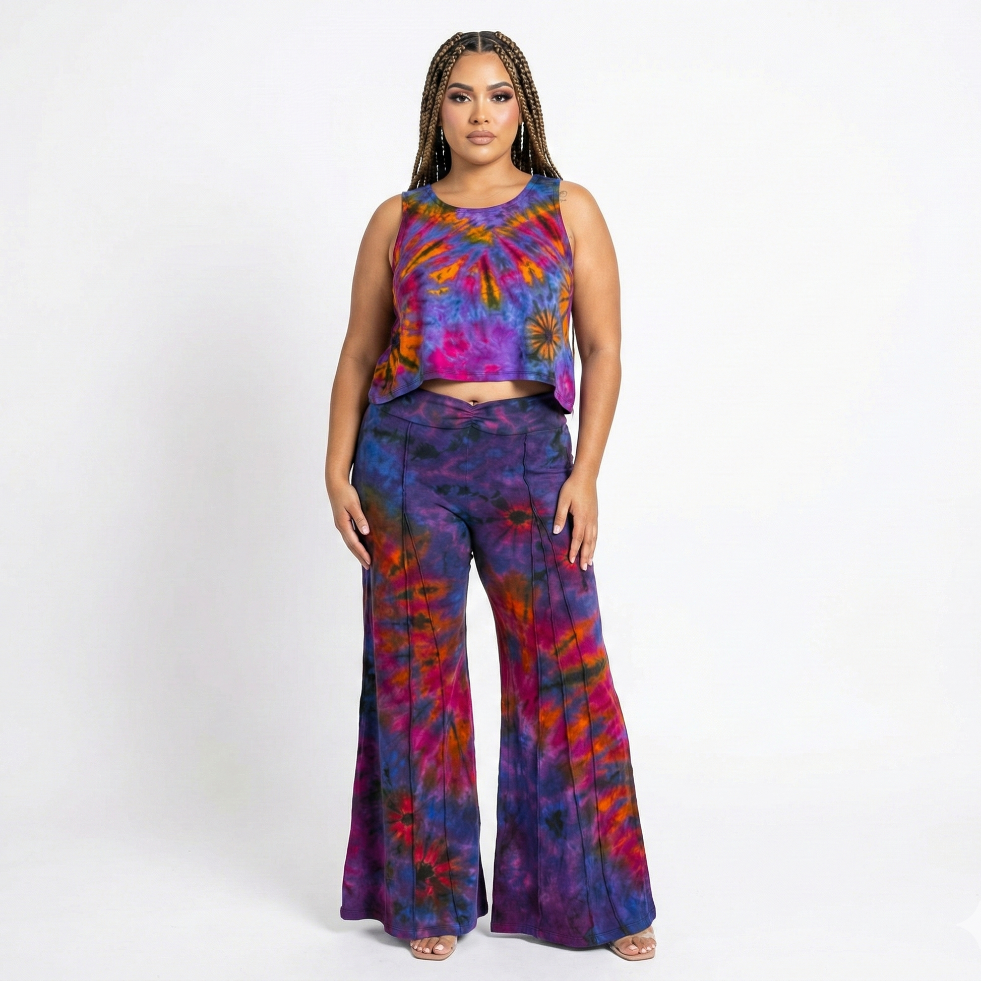 Woman wearing a tie-dye outfit on a white background