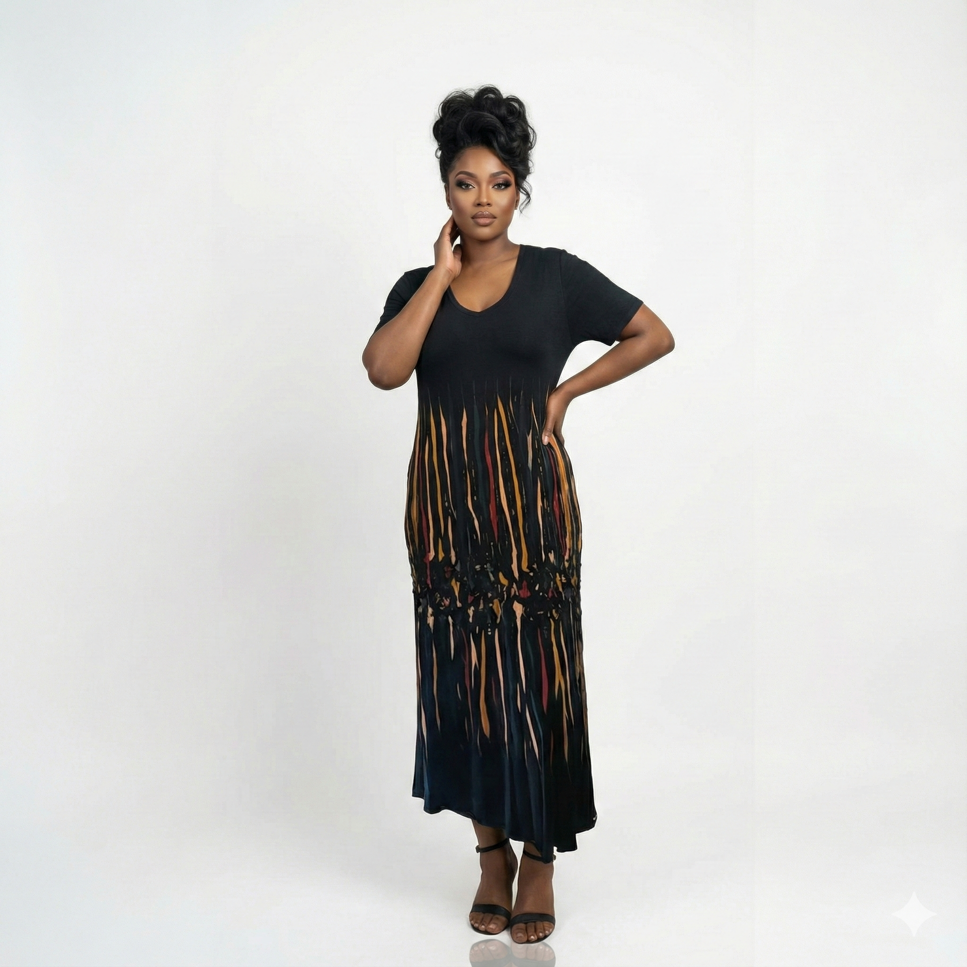 Woman wearing a black dress with a colorful pattern on a white background