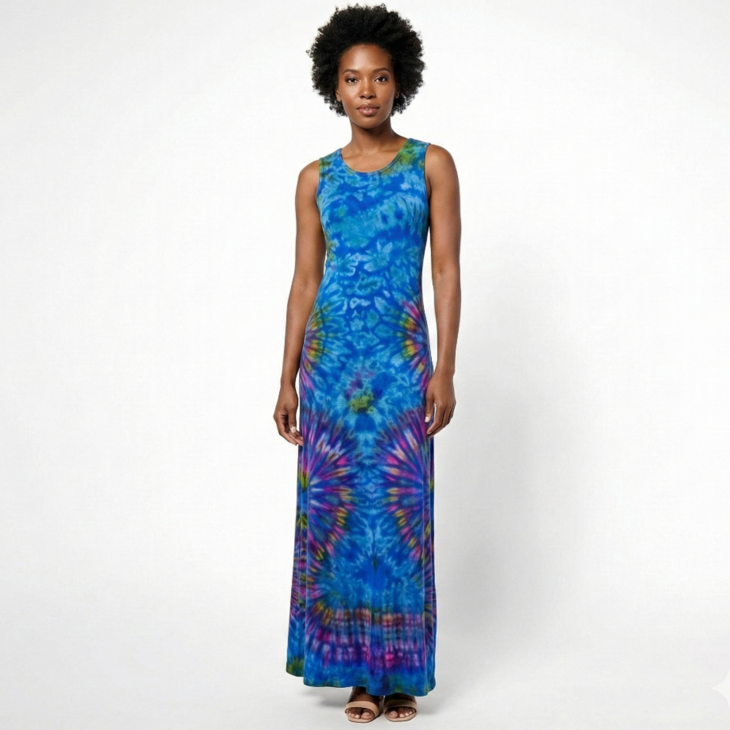 Woman wearing a blue tie-dye dress on a white background