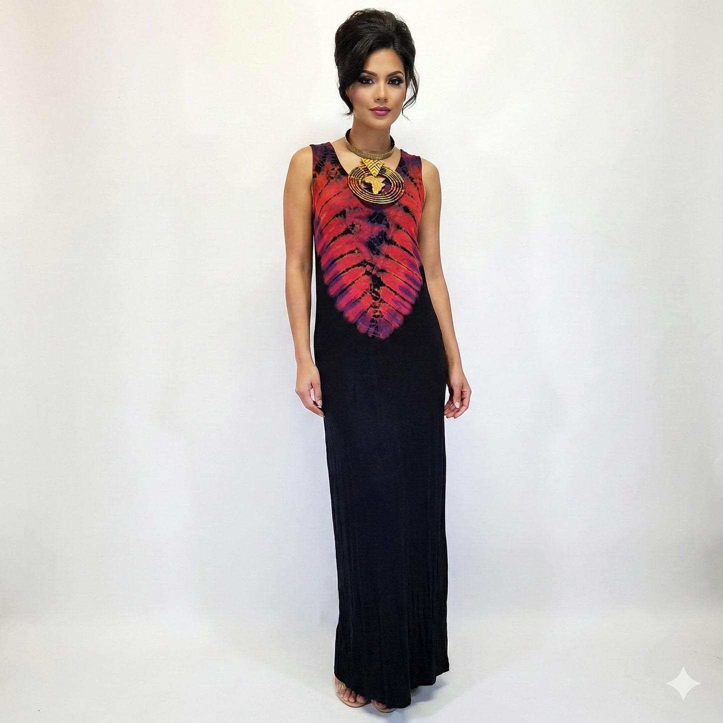 Woman wearing a black dress with a red and orange tie-dye pattern on a white background