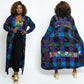 Woman wearing a colorful patchwork duster from front and back views on a white background
