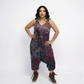 Woman wearing a tie-dye jumpsuit on a white background