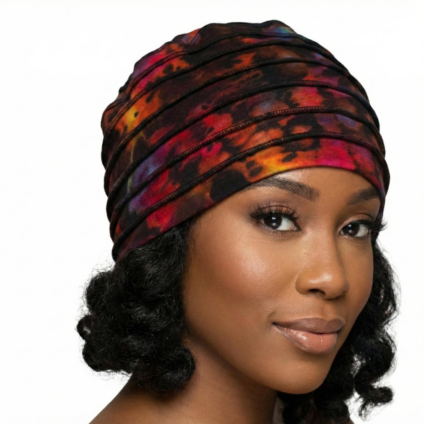 Woman wearing a colorful tie dye hat on a white background-Sanjules