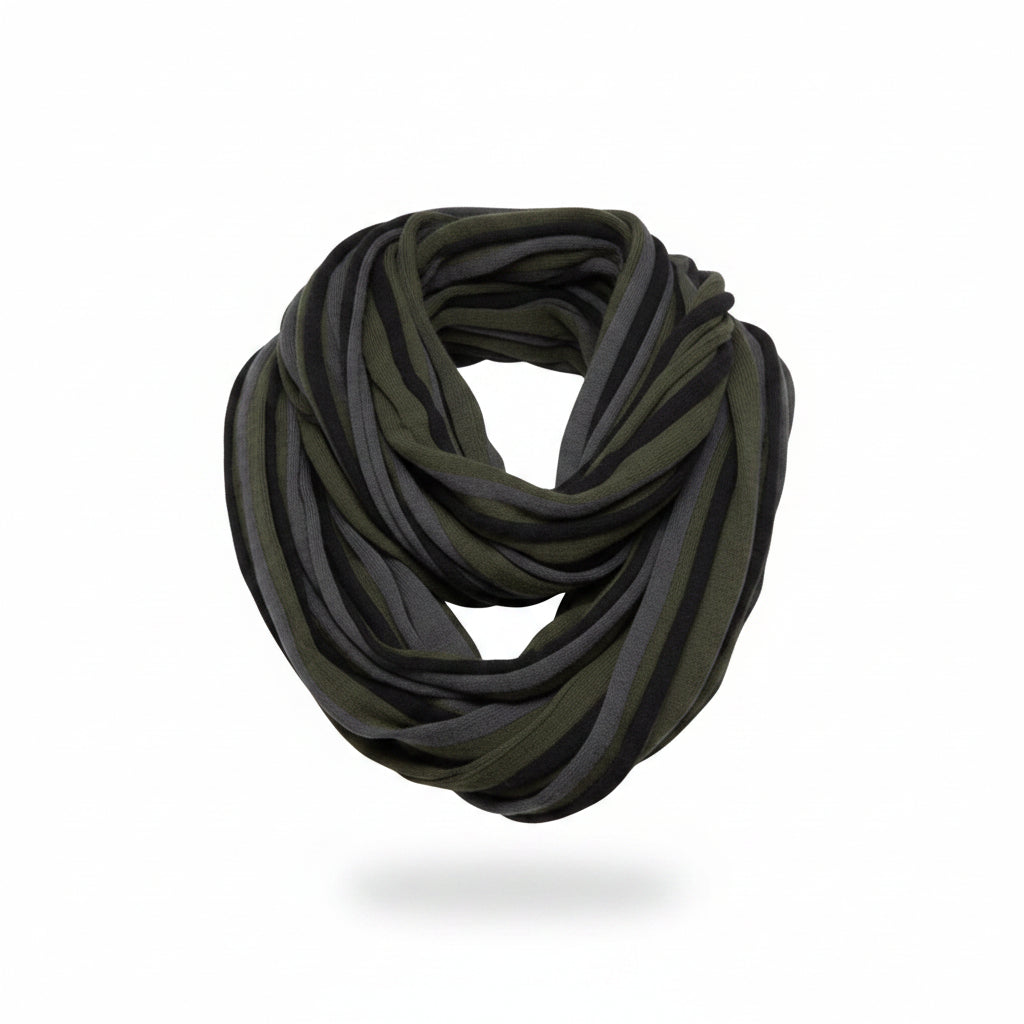 Woman wearing a green and gray infinity scarf against a white background