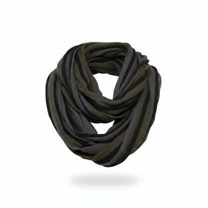 Woman wearing a green and gray infinity scarf against a white background