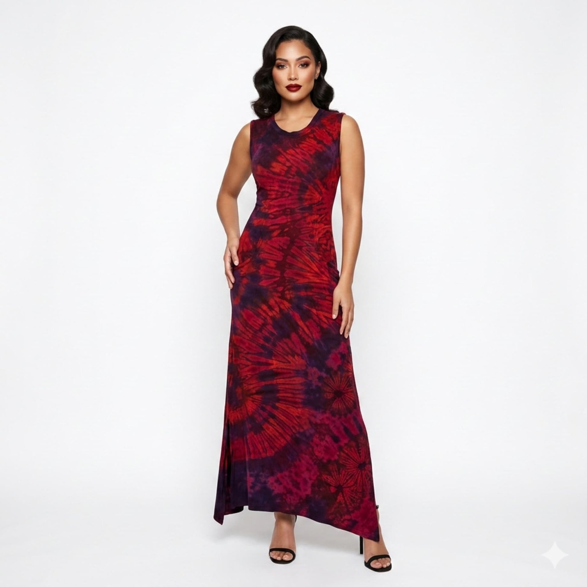 Woman wearing a red and black tie-dye dress on a white background
