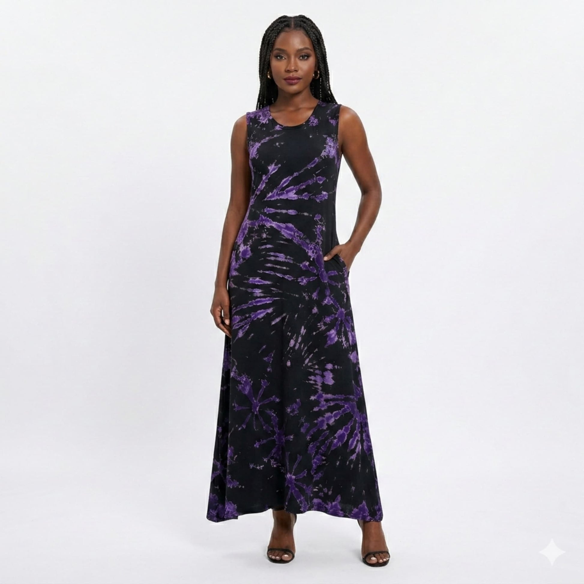 Woman wearing a black and purple tie-dye dress on a white background