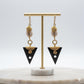Kenyan brass, cowrie shell, and black bone drop earrings with golden wire-wrapping 