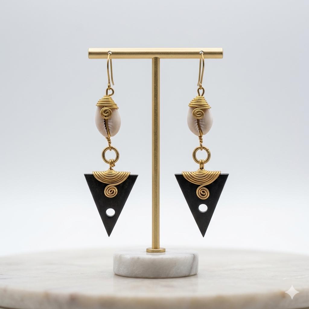 Kenyan brass, cowrie shell, and black bone drop earrings with golden wire-wrapping 
