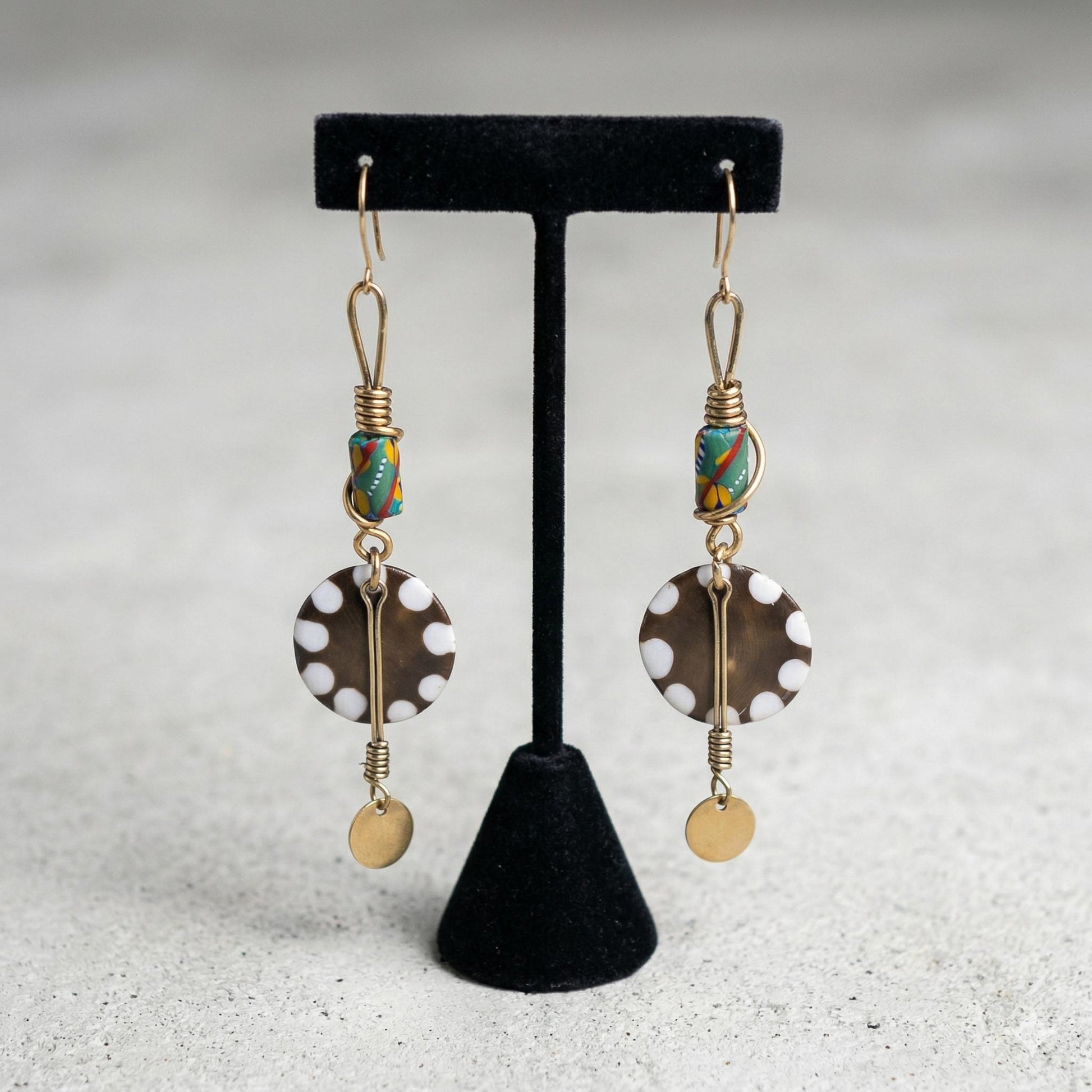 Kenyan brass, cowrie shell, and bone drop earrings with colorful beads and gold accents 