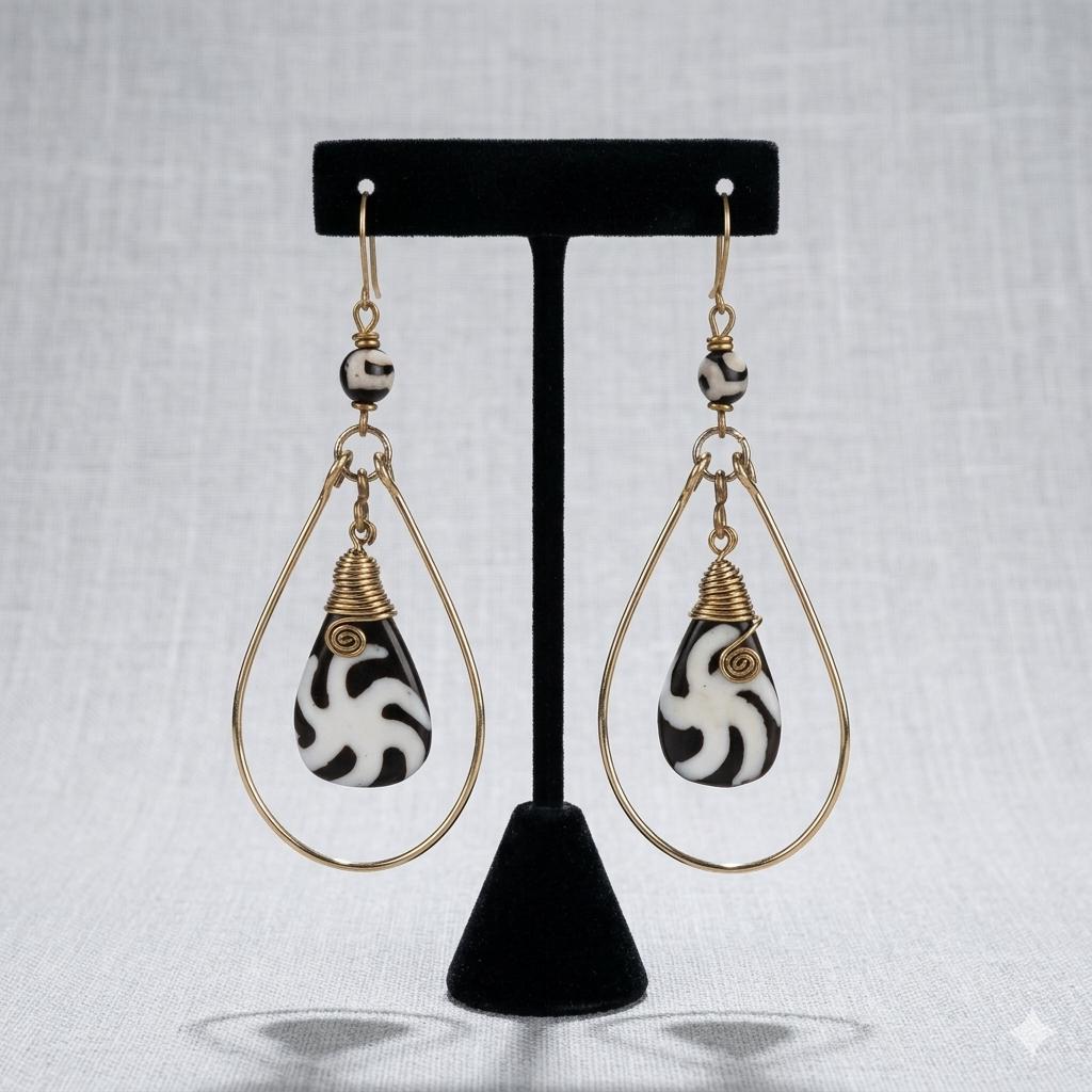 Kenyan brass teardrop earrings with black and white swirl bone drops and small bone beads.