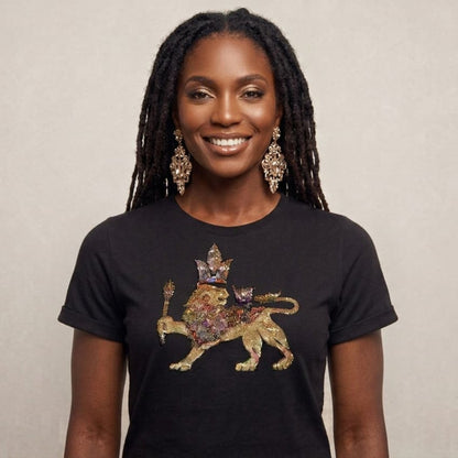 Woman wearing a black t-shirt with a colorful lion design on a beige background