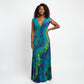 A sleeveless V-neck maxi dress with a vibrant tie-dye pattern in shades of blue, green, and purple,