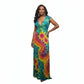 A woman wearing a sleeveless V-neck maxi dress with a vibrant tie-dye spiral pattern