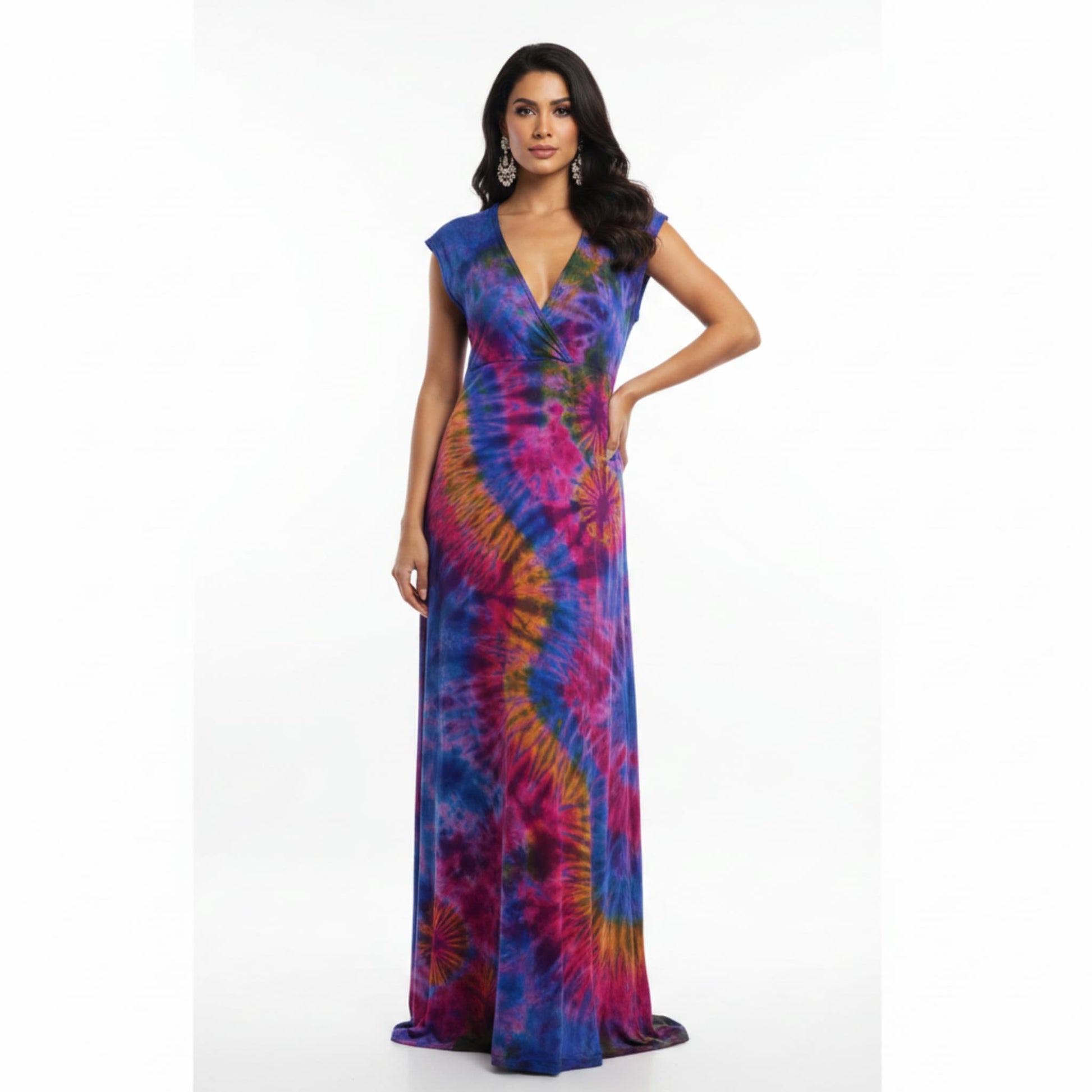 A woman modeling a floor-length wrap-style maxi dress with a vibrant tie-dye spiral pattern 