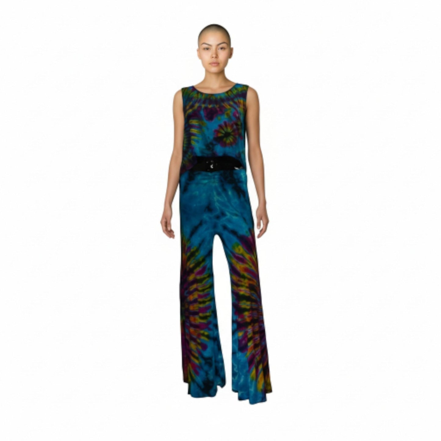 Model wearing a tie-dye top and pants a white background