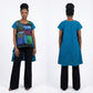 Woman wearing a teal tunic with a colorful patchwork design on a white background