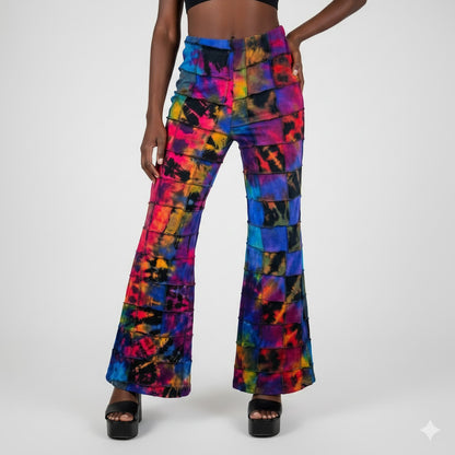 Colorful patchwork flared pants worn by a model on a white background