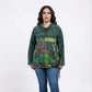 Woman wearing a patchwork hoodie with a white background