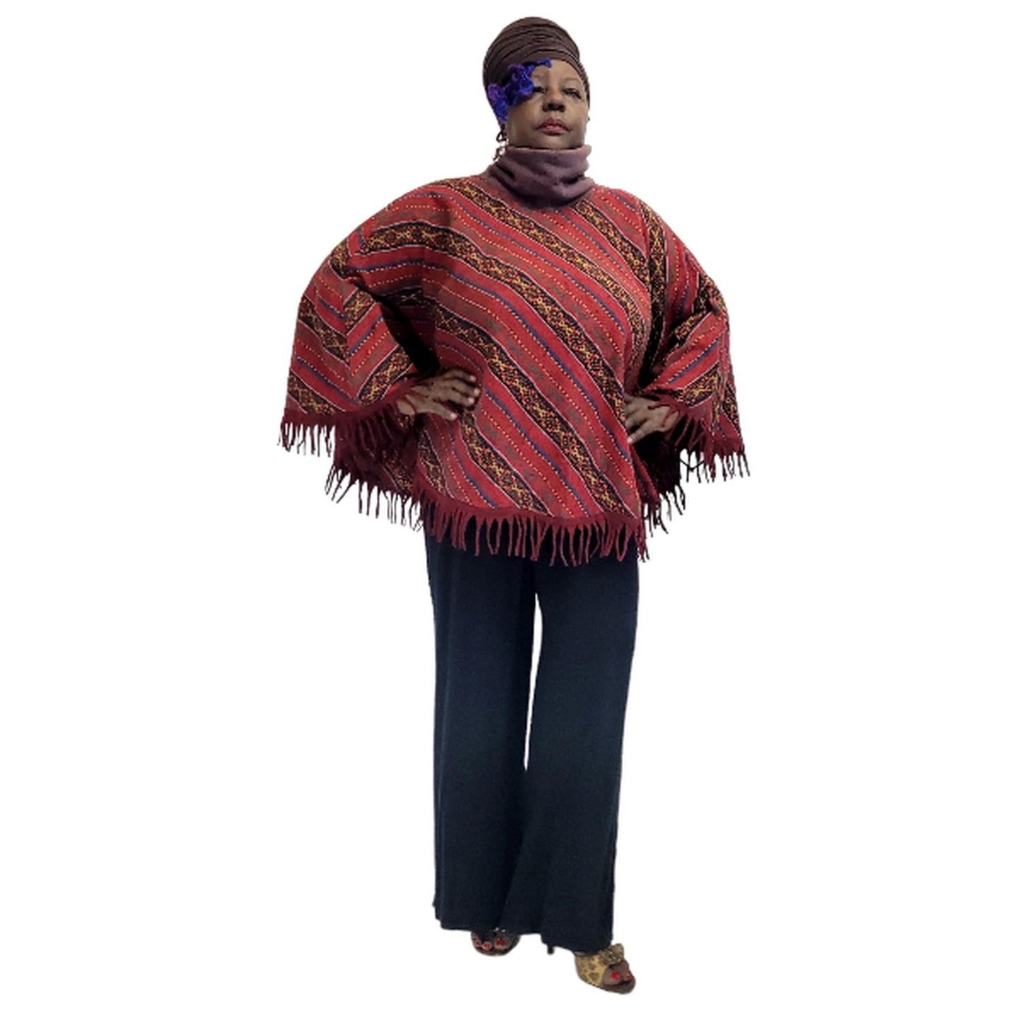 "Fleece-lined turtleneck detail on handloomed cotton poncho - cozy winter neckline"