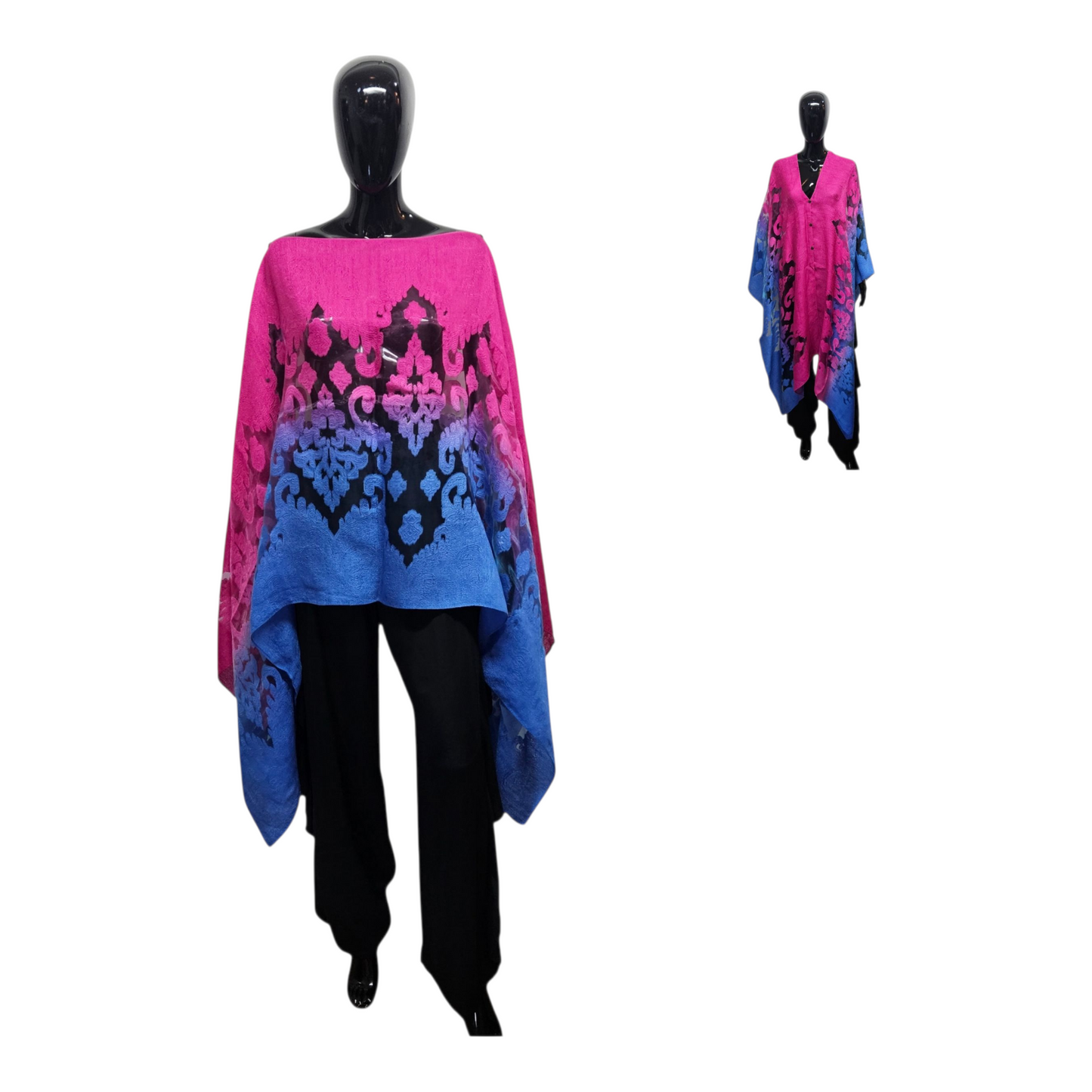 Mannequin wearing a pink and blue patterned poncho with black pants on a white background