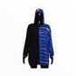 Mannequin wearing a black outfit with a blue and white patterned hood on a white background