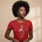 Woman wearing a red t-shirt with a decorative clef  music note design on a beige background