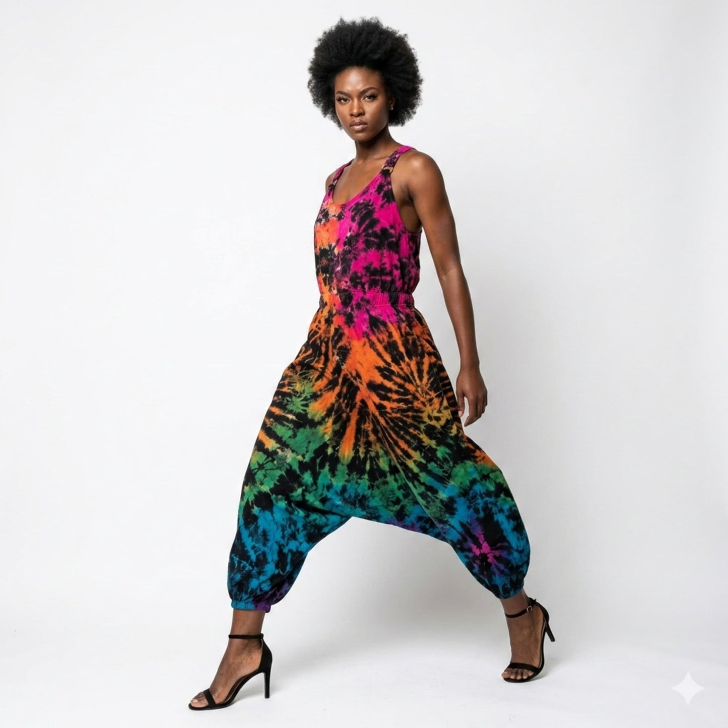 Woman wearing a tie-dye harem jumpsuit on a white background SanJules