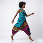 Person wearing a tie-dye harem jumpsuit on a white background SanJules