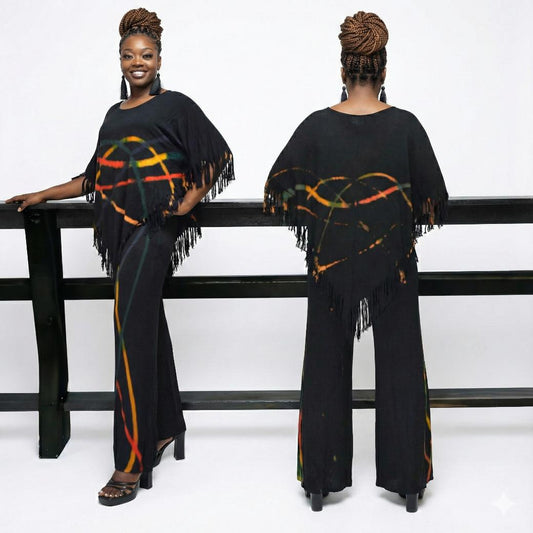 Woman wearing a black outfit with colorful patterns and fringes, SanJules