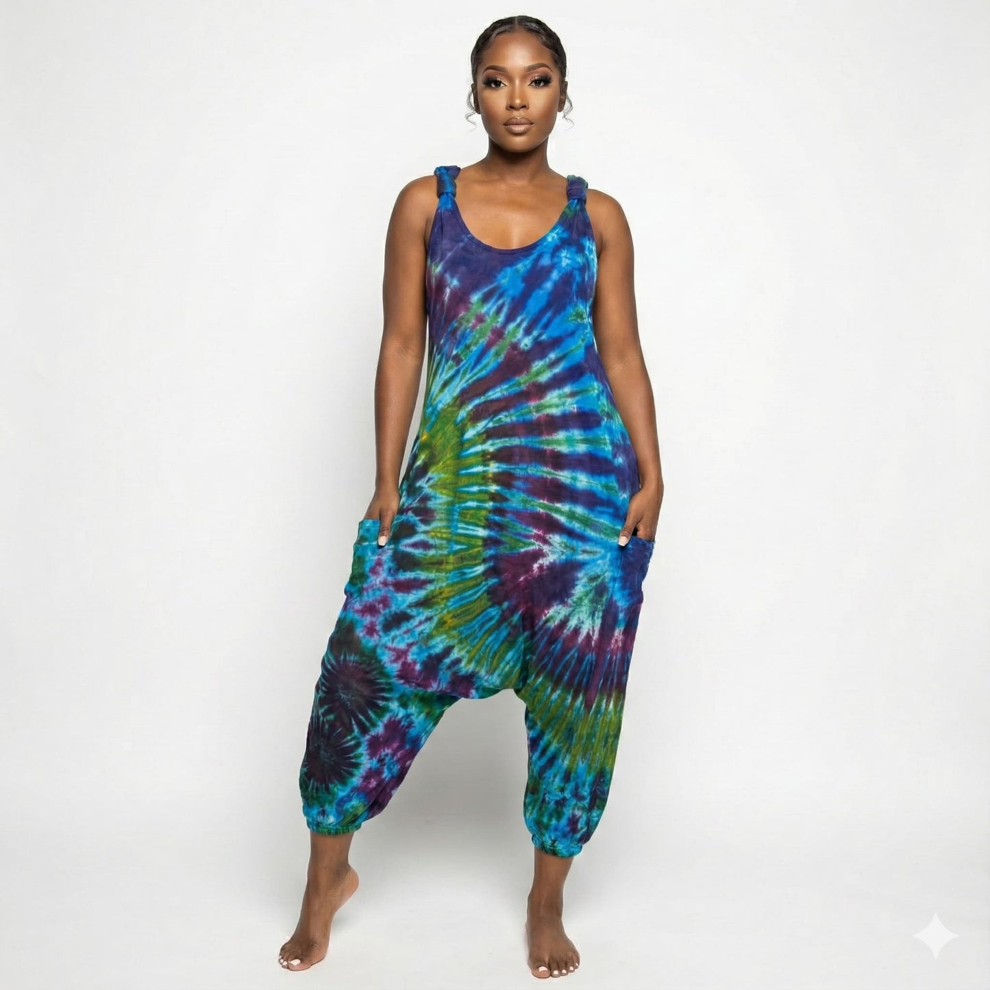 Person wearing a tie-dye jumpsuit on a white background SanJules